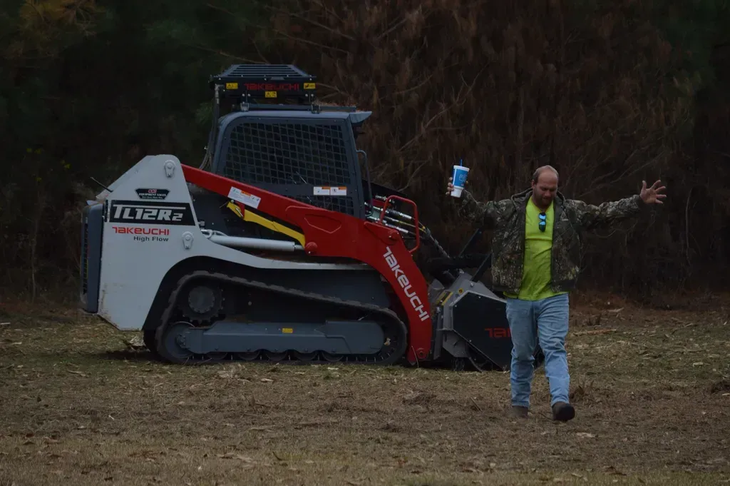 DC Tree Cutting crew posing with Takeuchi equipment